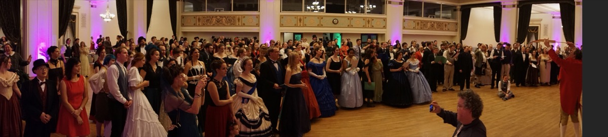 The crowded ballroom with hundreds of elegantly dressed dancers